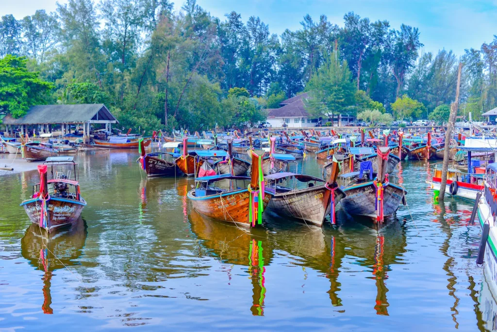 Experience a traditional longtail boat ride on a Krabi island tour.