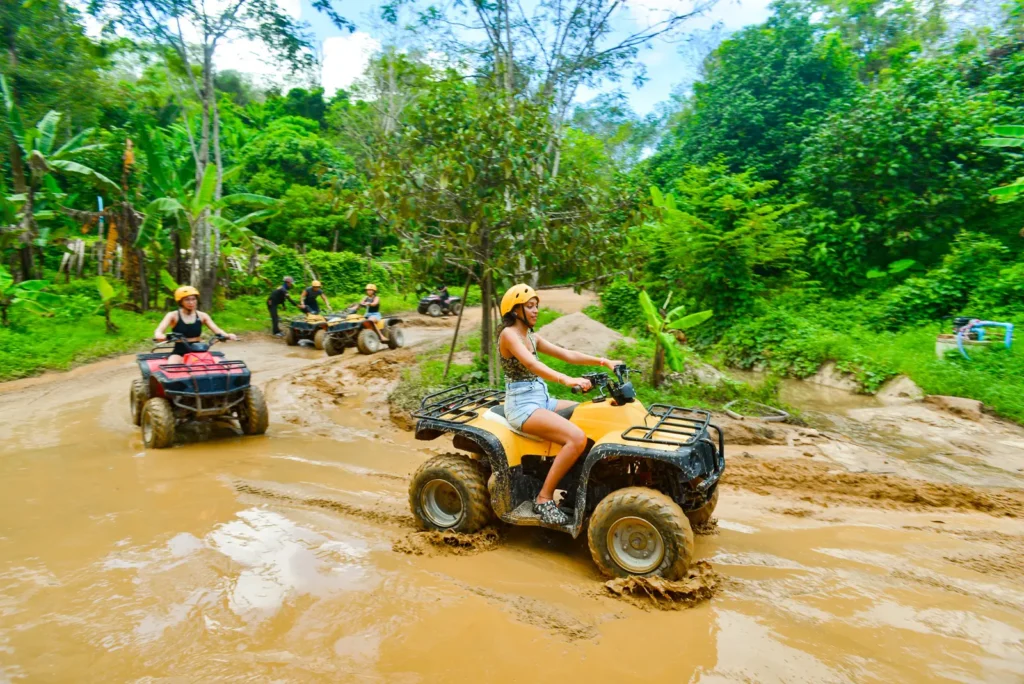Tourists enjoying an ATV ride on a guided Phuket ATV tour.