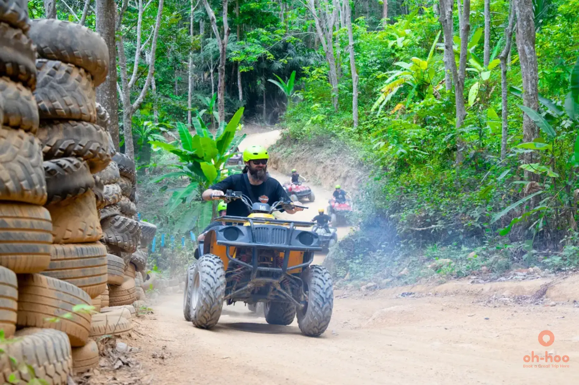 phuket atv tour rider on jungle trail through rubber plantation