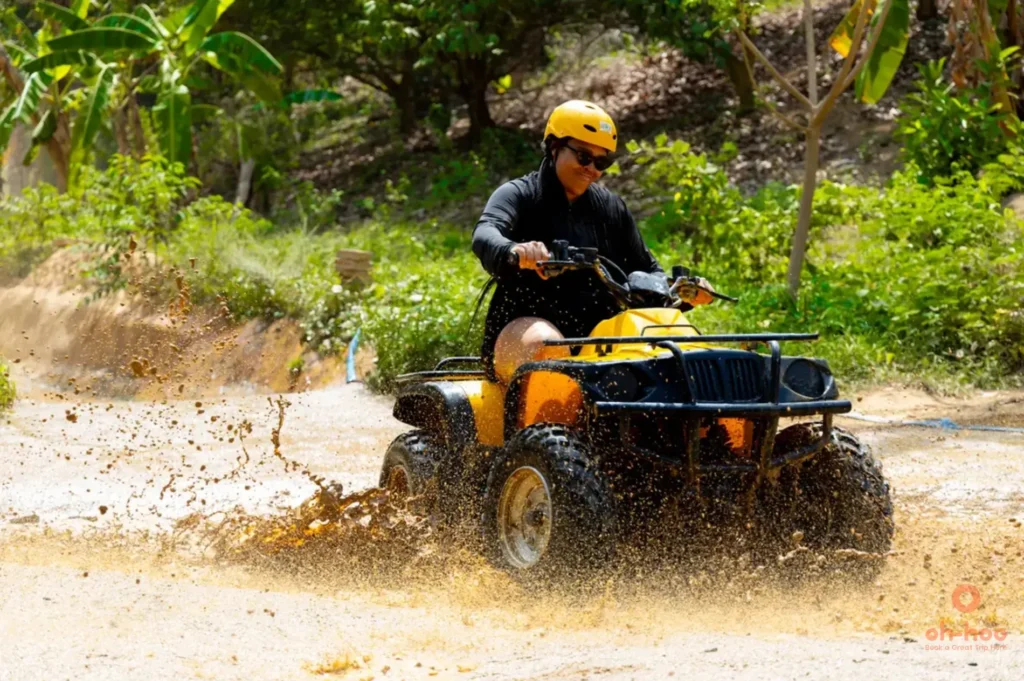 phuket atv tour rider navigating muddy jungle trail adventure