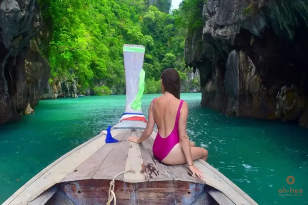 passengers on a longtail boat, Hong Island tour, Krabi limestone karst scenery