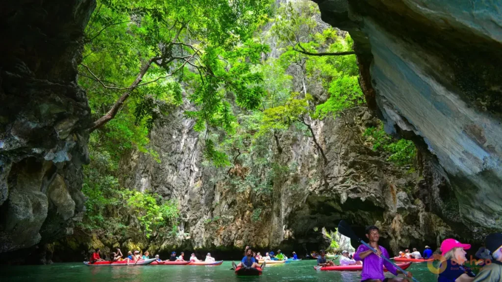 Canoeing through Panak Island and hidden lagoons during a Phang Nga Bay tour from Phuket