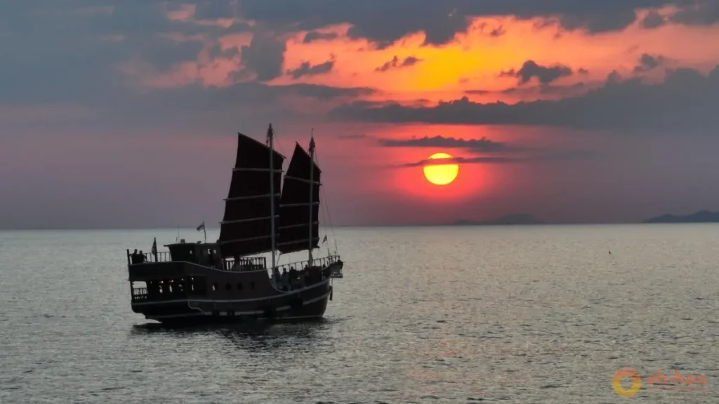 This image shows a traditional sunset cruise boat sailing in Krabi, Thailand, highlighting sunset cruises and romantic sea views as one of the best things to do in Krabi for couples and travelers looking for a relaxing evening activity.