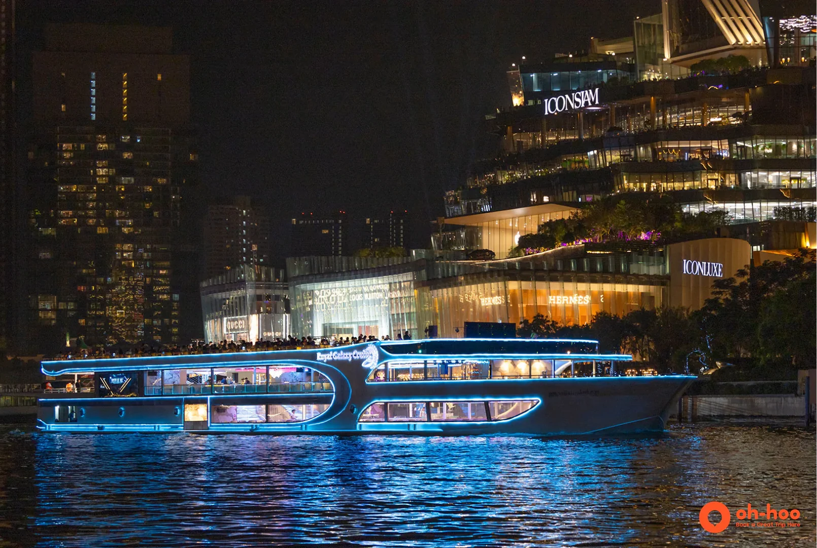 ICONSIAM lit up at night on the Chao Phraya River, a departure point for Bangkok dinner cruises