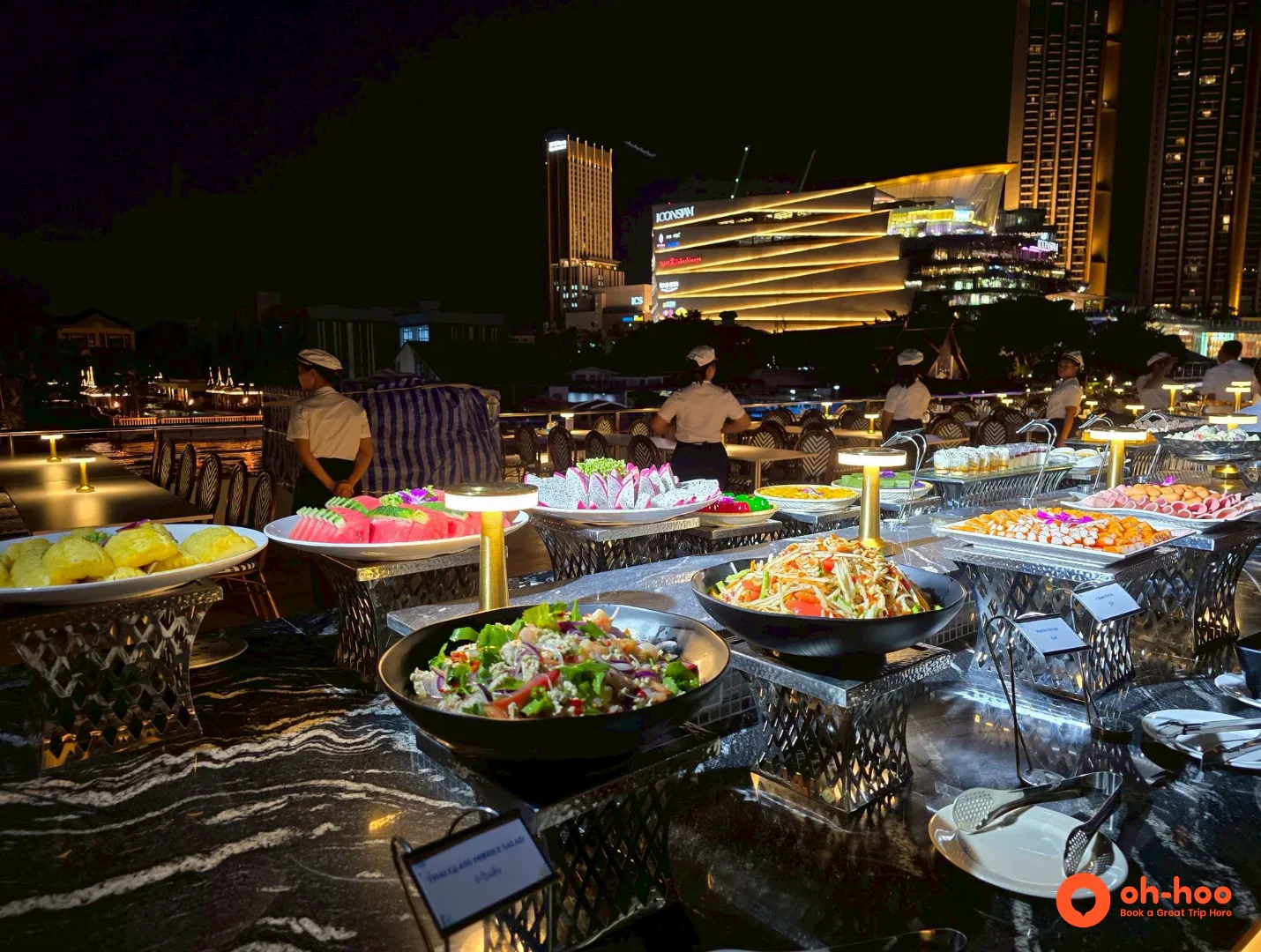 Buffet spread of Thai dishes and fresh fruit aboard a Chao Phraya dinner cruise in Bangkok