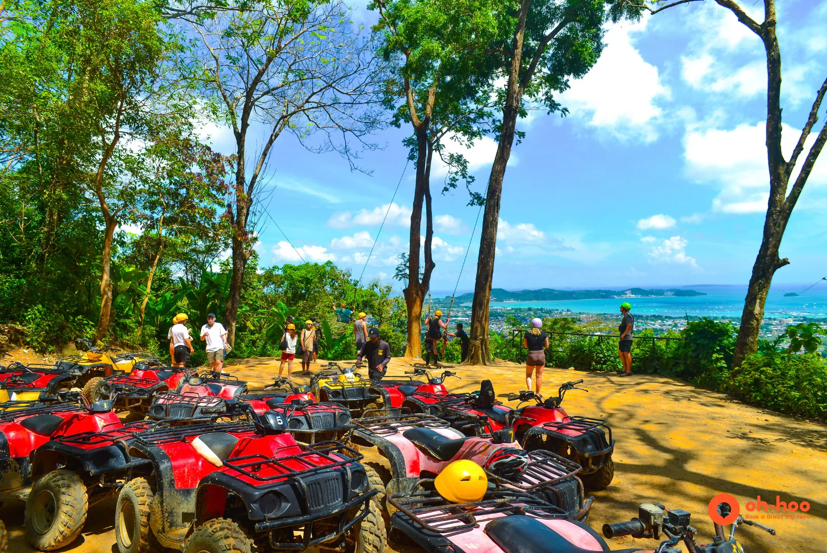Row of ATVs at a hilltop viewpoint overlooking the coast on a Phuket ATV tour