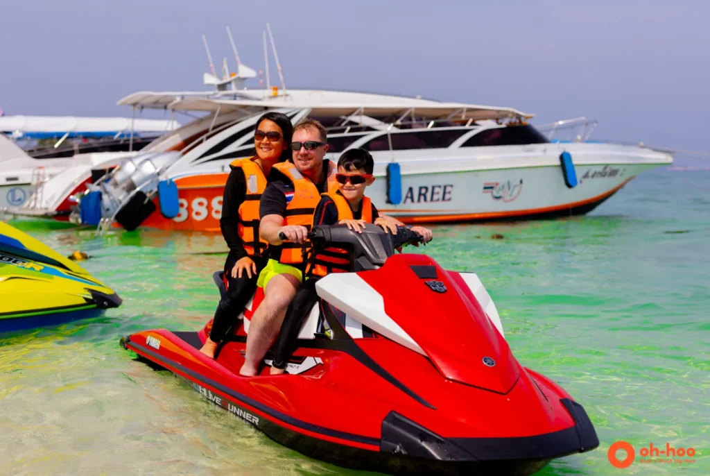 Rider on a jet ski beside a limestone island on a Phuket jet ski tour to 7 islands