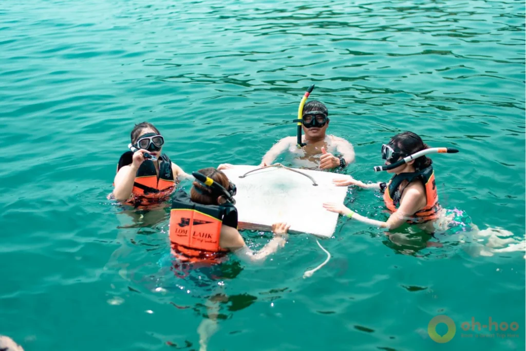 Snorkeler wearing a life vest at a snorkeling stop in the Ang Thong National Marine Park