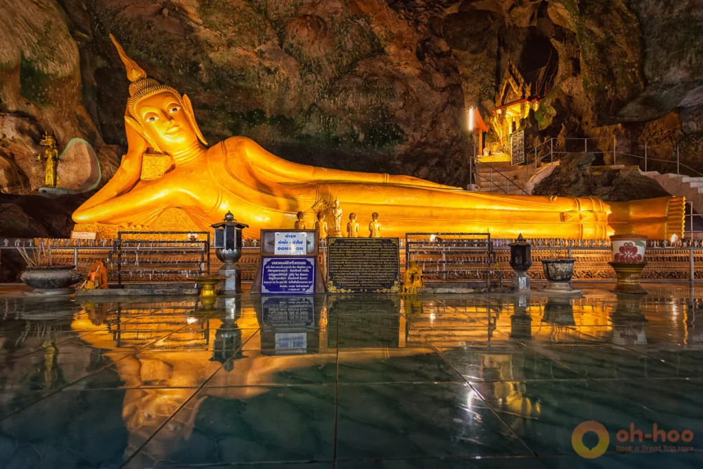 Golden reclining Buddha inside Suwankuha Temple (Monkey Cave) Temple, a cultural stop on the Khao Lak bamboo rafting day trip