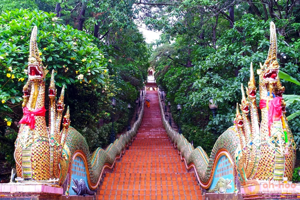 Historic Naga serpent staircase leading up to Wat Phra That Doi Suthep surrounded by forest