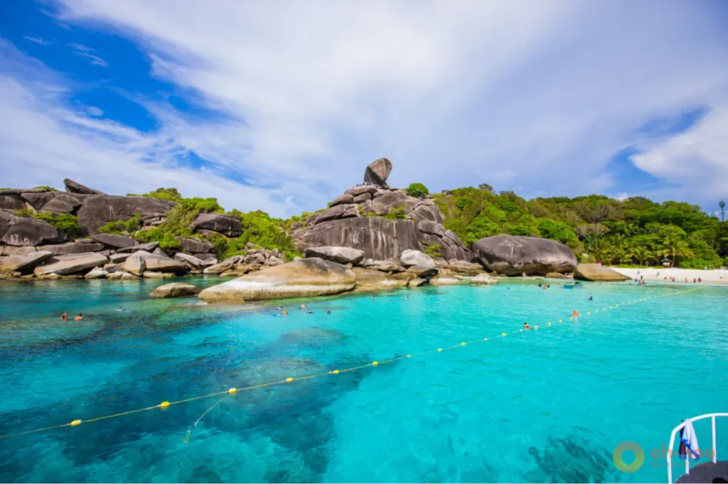 Crystal-clear turquoise water, white sand, and dramatic granite boulders at the Similan Islands near Khao Lak.