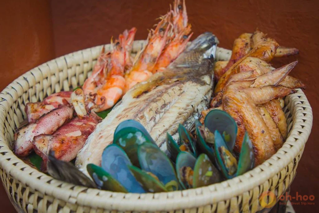 Fresh grilled seafood plate at a beachfront shack in Kamala Beach