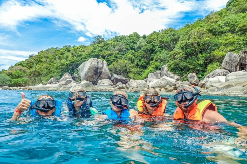 Snorkellers floating above the sandy shallows of Shark Bay
