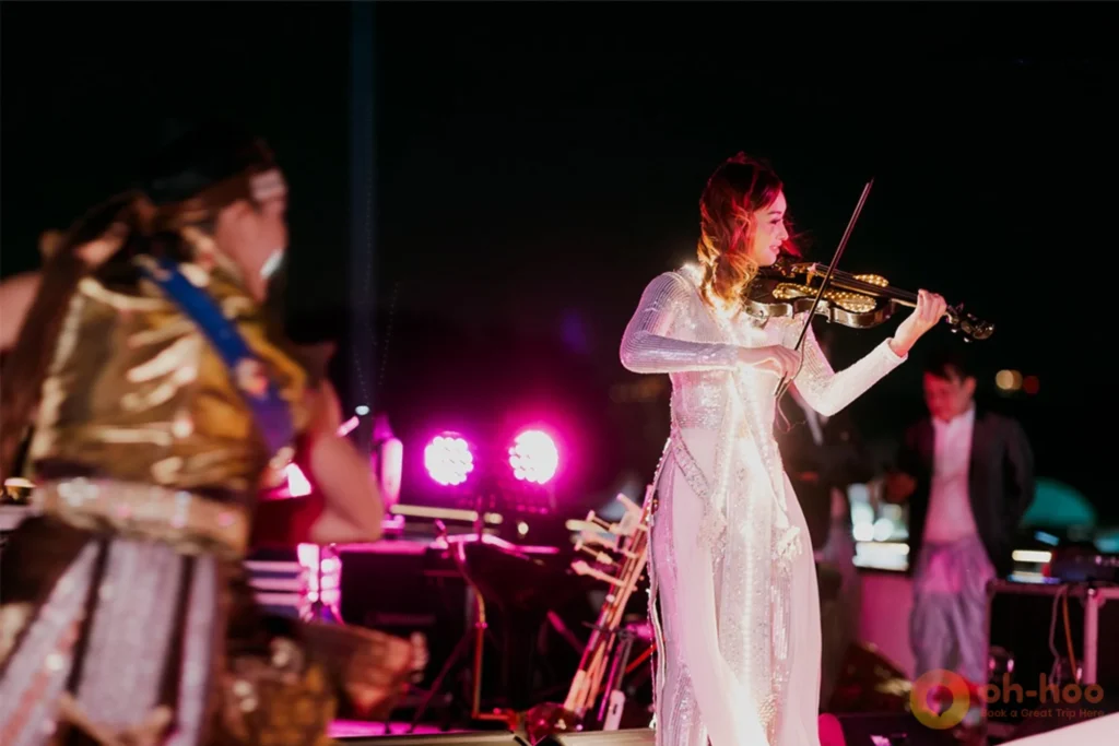 Live band performing in the main dining cabin of a Bangkok river dinner cruise