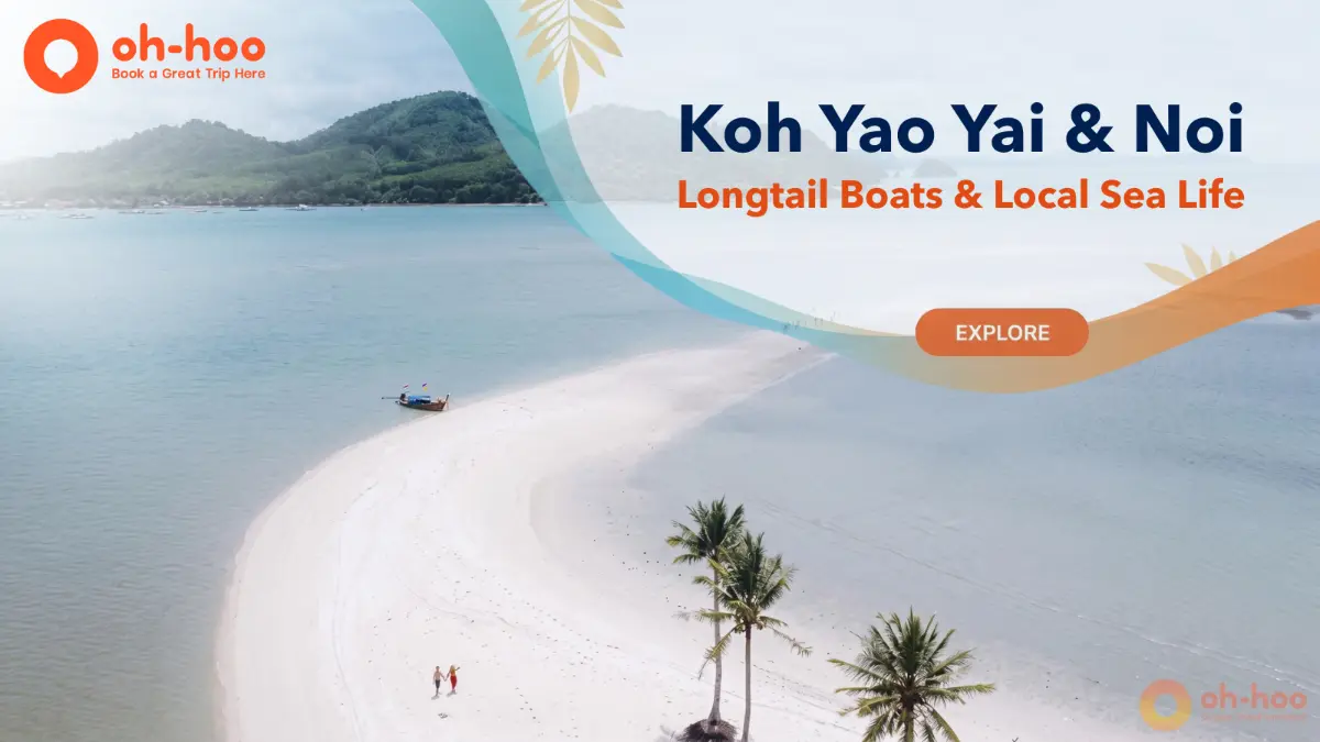 Aerial view of a white sandbar, longtail boat, and turquoise water around koh yao yai and koh yao noi in Phang Nga Bay.