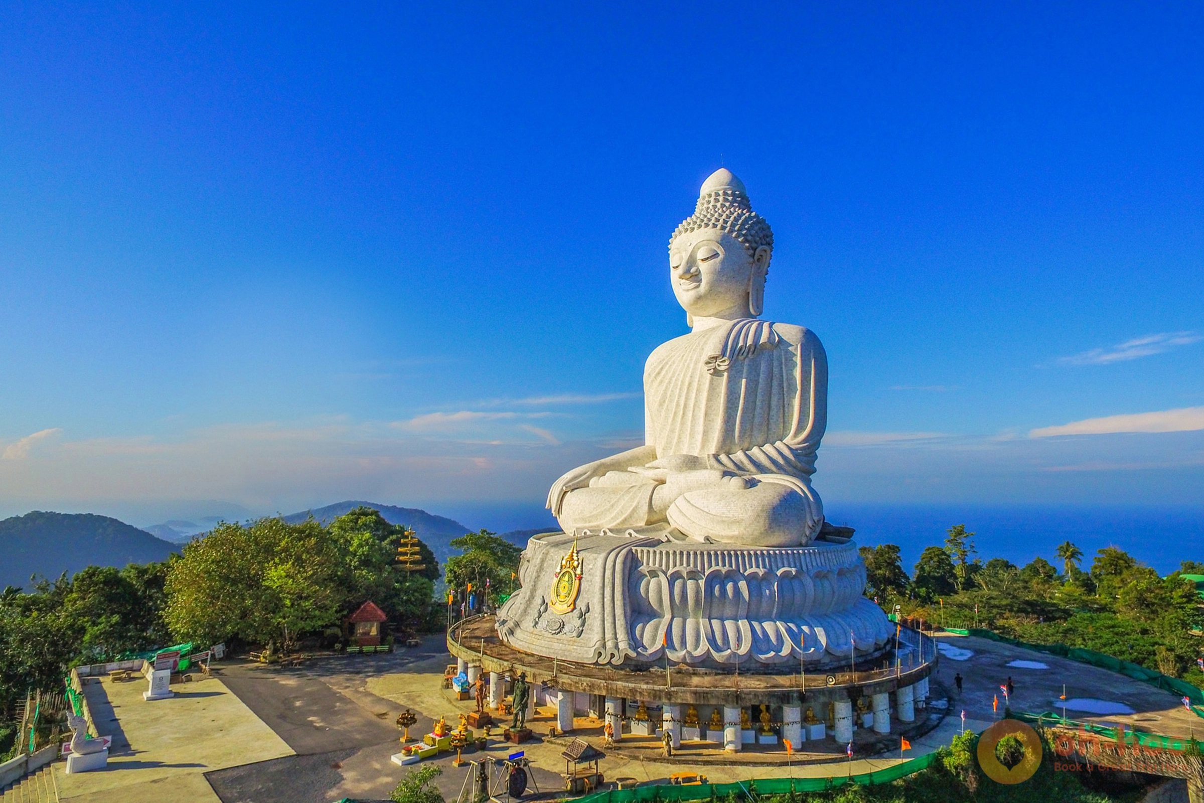 The white marble Big Buddha statue on Nakkerd Hill in Phuket seen against a clear sky