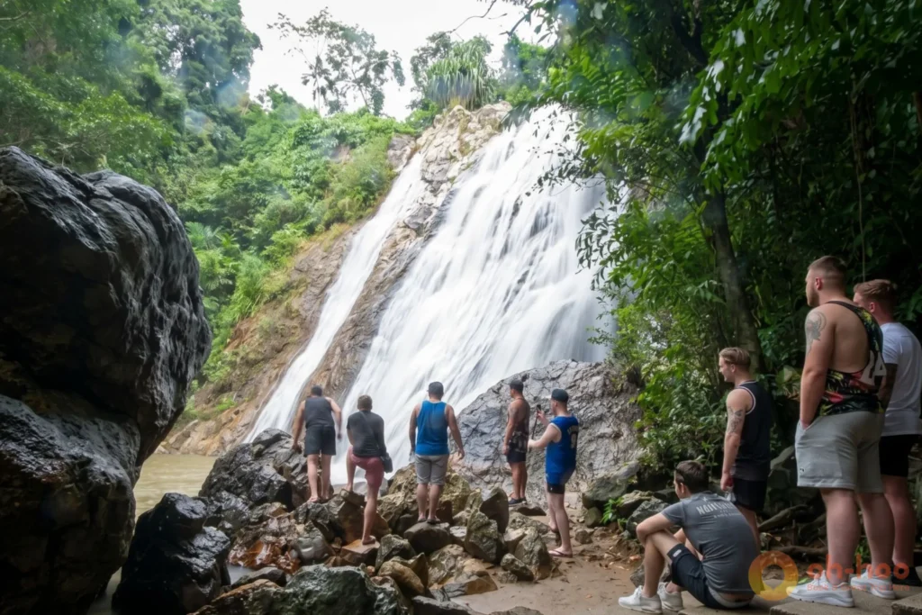 Na Muang Waterfall cascading down purple granite rocks into a jungle pool in Koh Samui