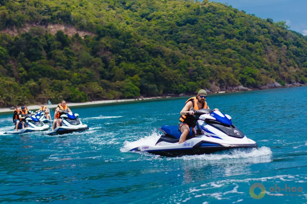 Group of jet ski riders exploring the coastline around Koh Samui
