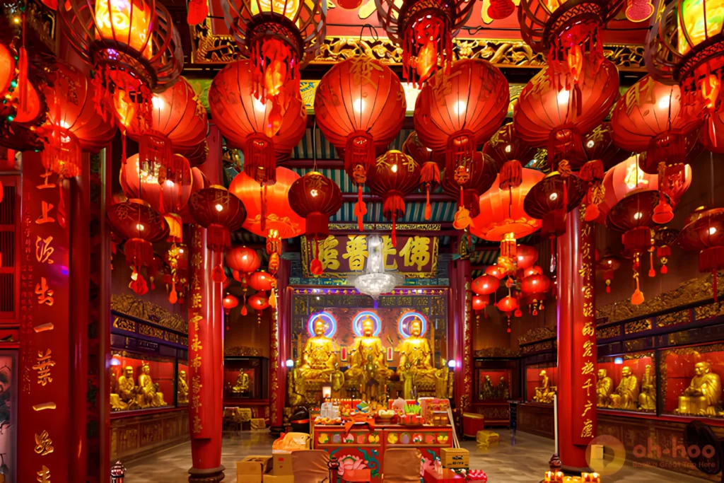 Worshippers lighting incense inside Wat Mangkon Kamalawat Chinese temple in Bangkok
