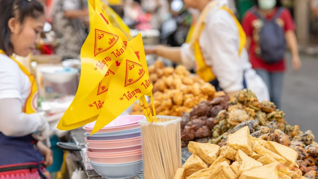 Jay vegetarian noodle and tofu dishes served at a street stall during the Bangkok Vegetarian Festival