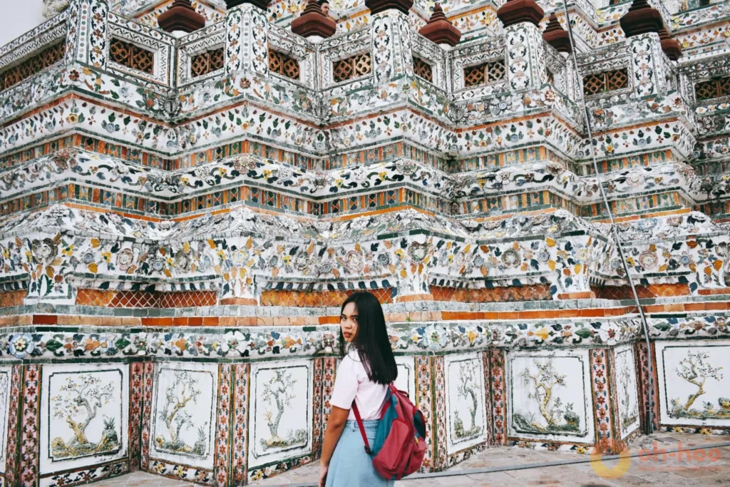 Wat Arun's spire covered in Chinese porcelain mosaic seen from the Chao Phraya River