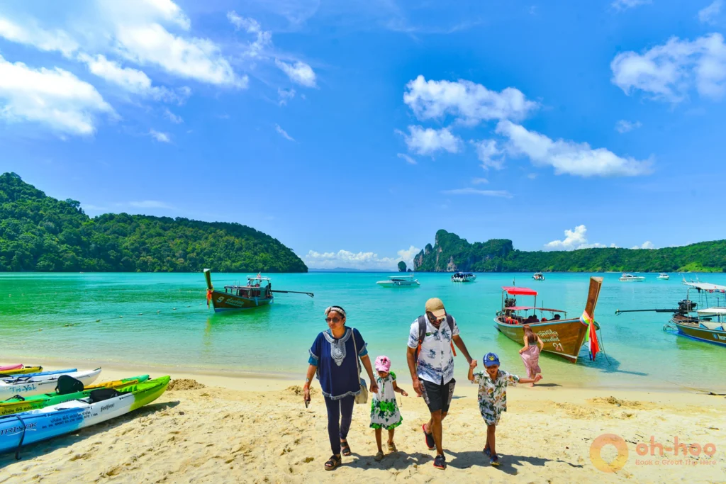 Family stepping off the ferry to explore Koh Phi Phi island